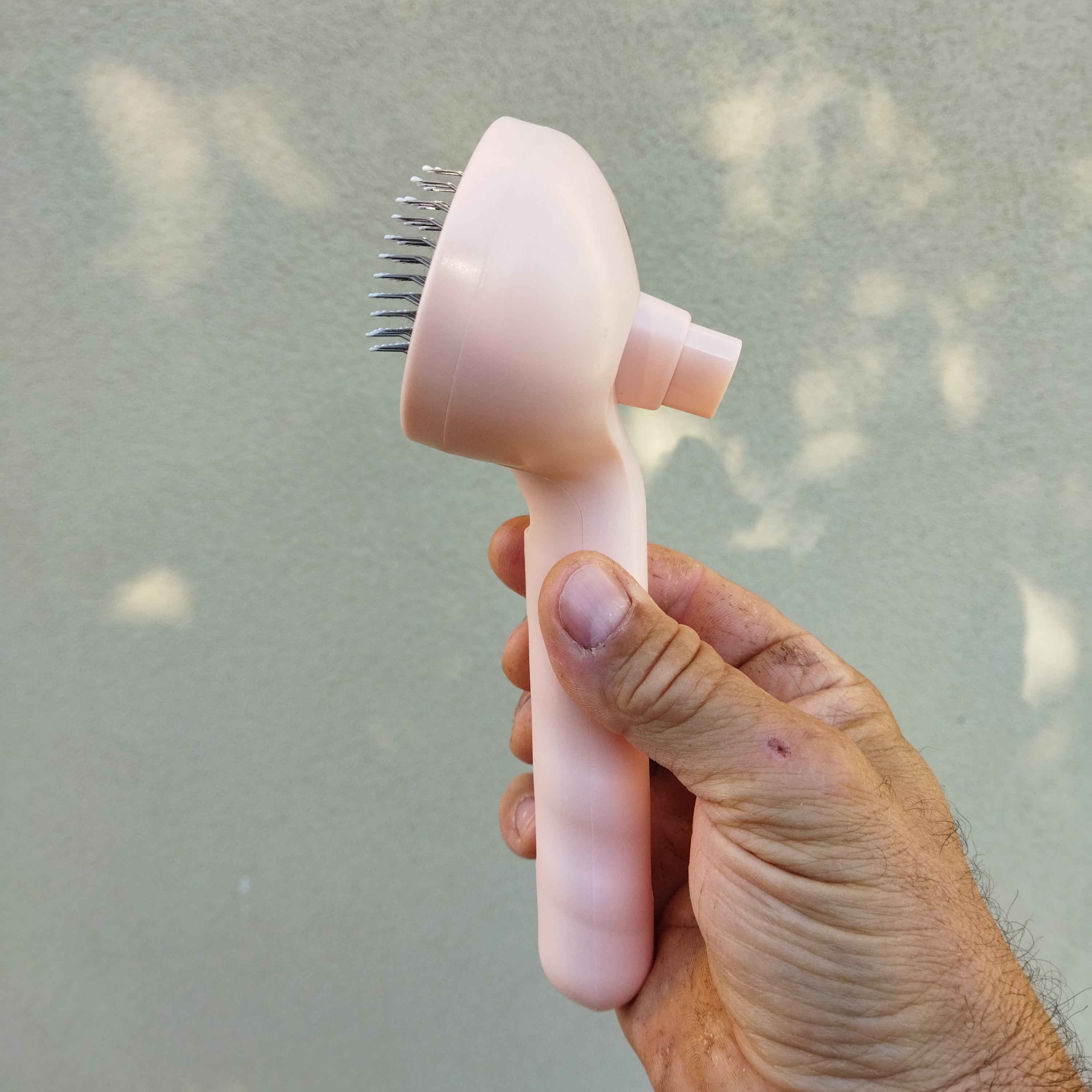 Brush with water spray