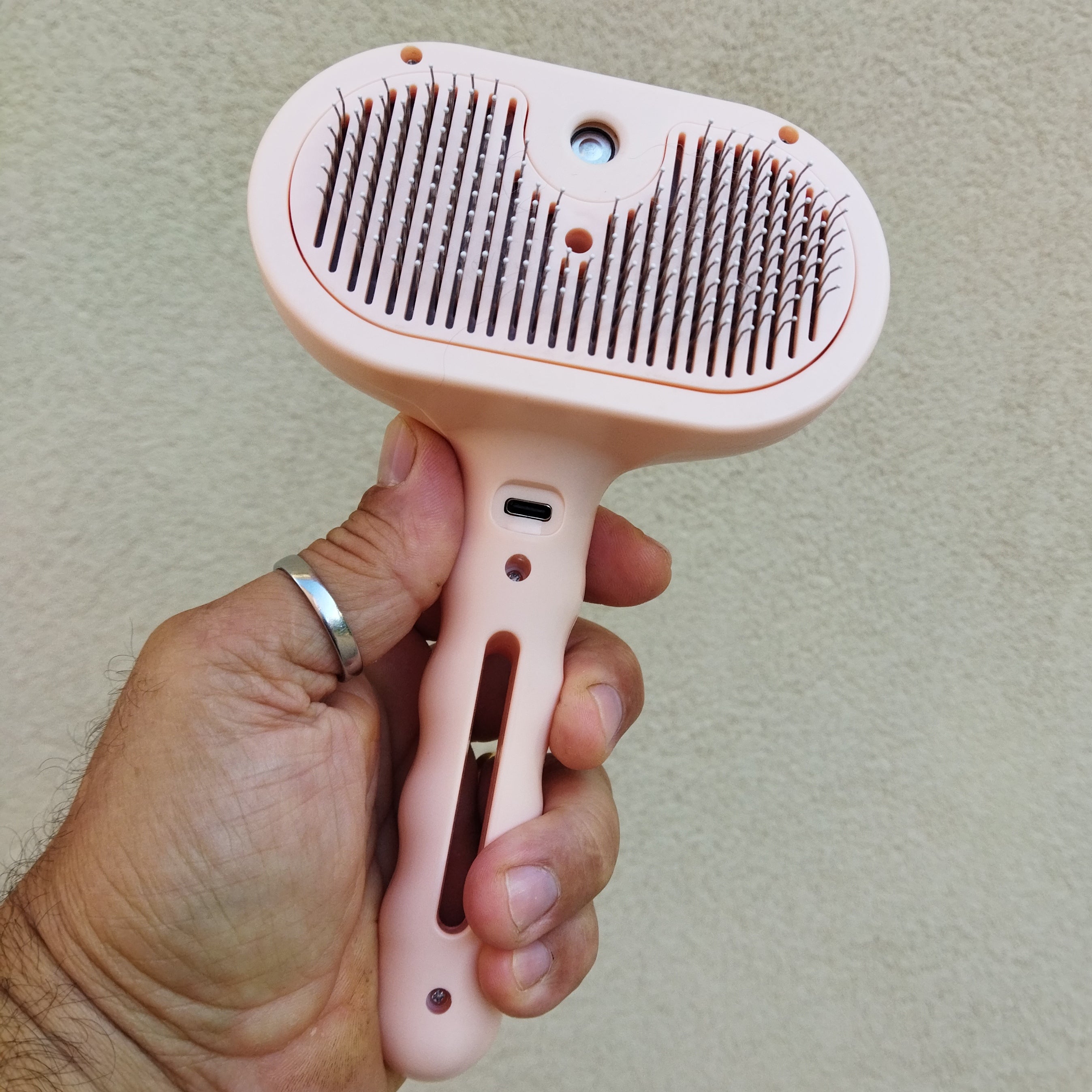 Self-cleaning brush